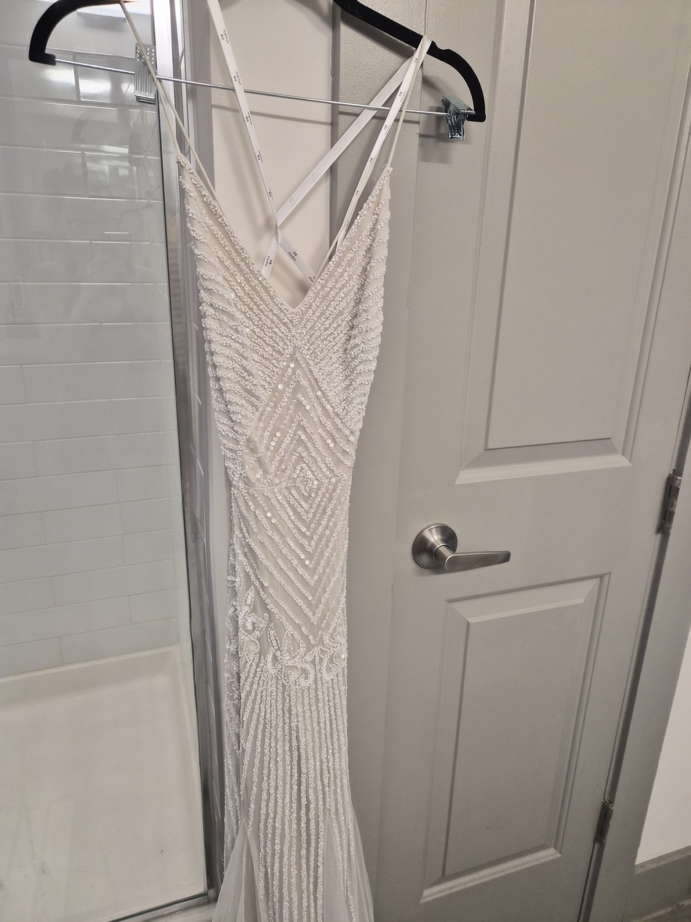 Elegant White Beaded Wedding Dress with V-Neck and Crisscross Straps